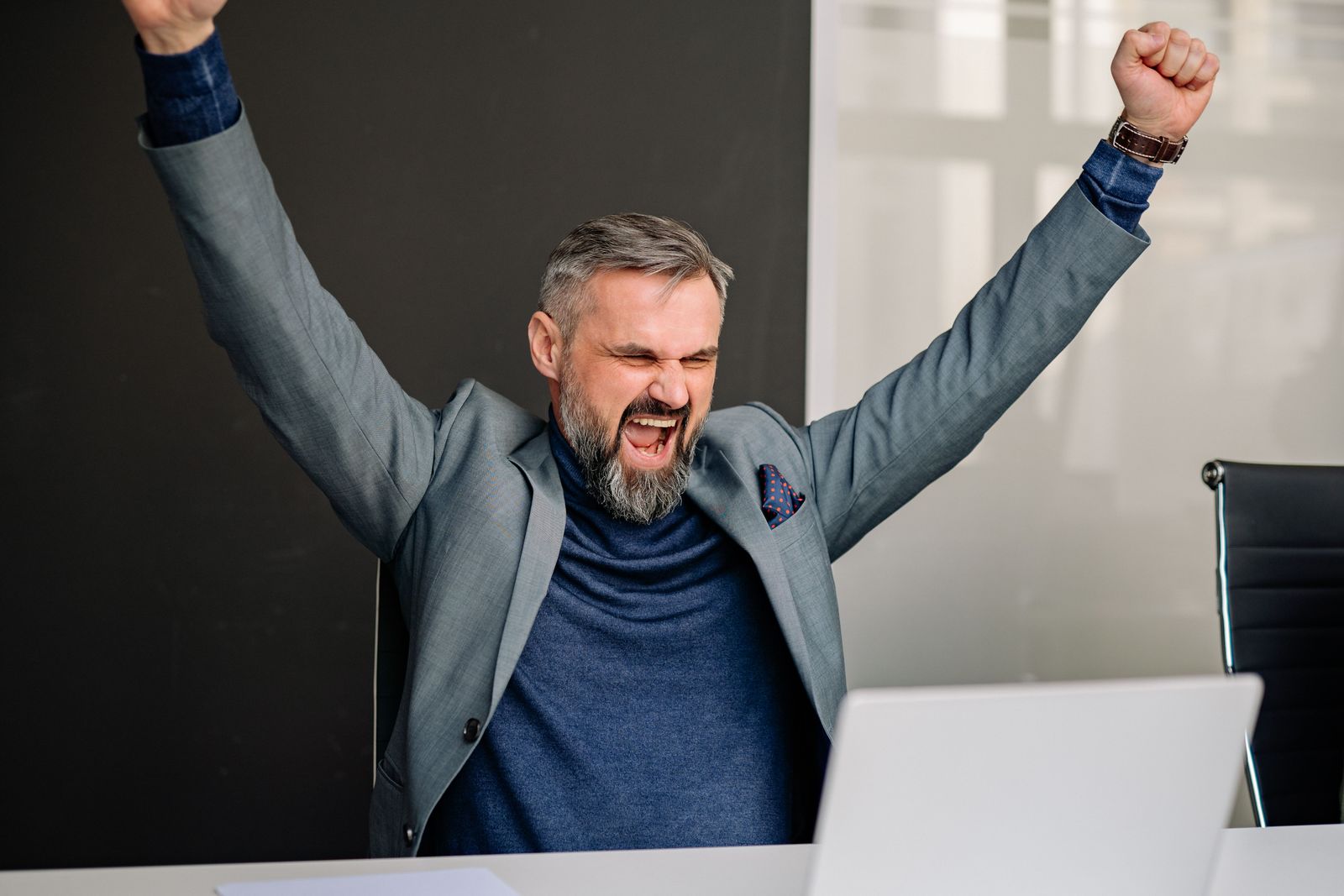 Executive celebrating a job offer